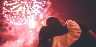 two people watching a professional firework display